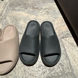 Black and beige Yeezy slides